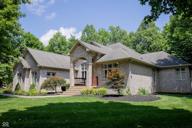 23119 Sonoma Ln, Cicero, IN 46034 - view of front of house with brick siding, a front lawn, and a shingled roof