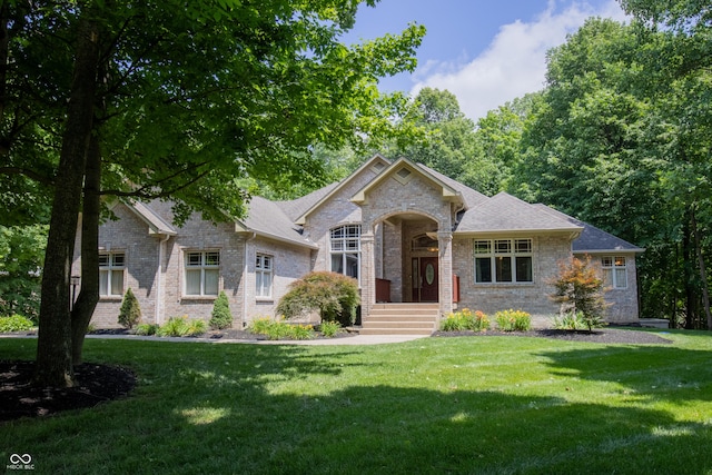 23119 Sonoma Ln, Cicero, IN 46034 - view of front facade with brick siding, a front yard, and roof with shingles