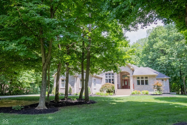 23119 Sonoma Ln, Cicero, IN 46034 - view of property hidden behind natural elements with a front yard and stone siding