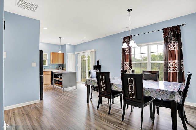 1571 N Creekwater Pass, Greenfield, IN 46140 - dining room with light wood-type flooring, a chandelier, and recessed lighting