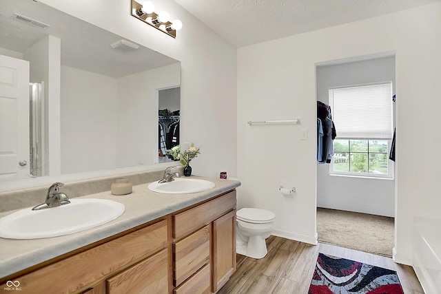 1571 N Creekwater Pass, Greenfield, IN 46140 - bathroom with double vanity and wood finished floors