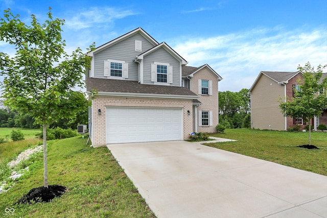 1571 N Creekwater Pass, Greenfield, IN 46140 - traditional-style home with an attached garage, concrete driveway, a front yard, and brick siding