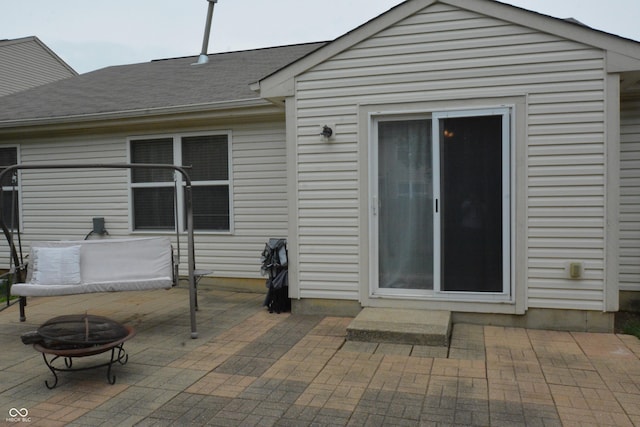 12389 Titans Dr, Fishers, IN 46037 - rear view of house with a fire pit, a patio area, and roof with shingles