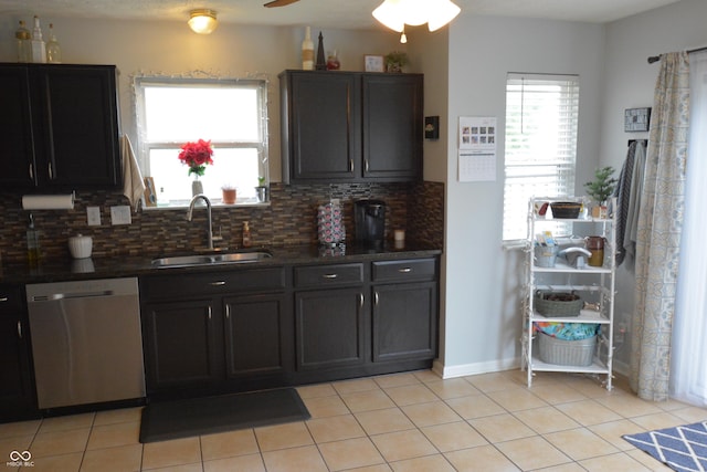 12389 Titans Dr, Fishers, IN 46037 - kitchen featuring dishwasher, tasteful backsplash, dark countertops, and light tile patterned floors