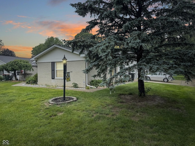 4329 Rutgers Dr Unit 40B, Anderson, IN 46013 - view of front of home with brick siding and a front yard