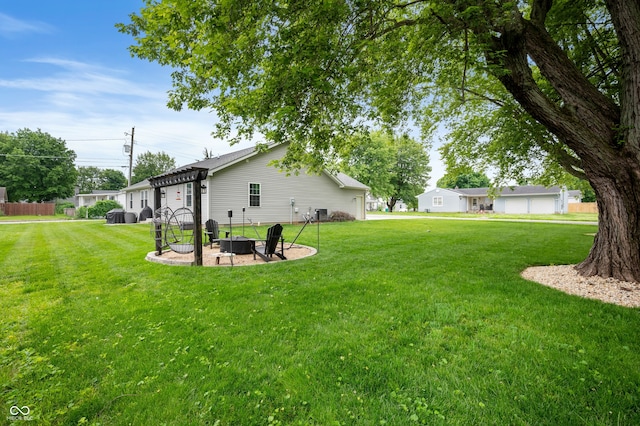 284 E Silver St, Knightstown, IN 46148 - view of grassy yard featuring a fire pit