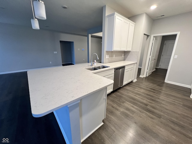 6729 Birmingham Ave, Mccordsville, IN 46055 - kitchen featuring stainless steel dishwasher, a peninsula, dark wood-style floors, white cabinets, and tasteful backsplash