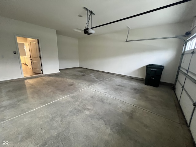 6729 Birmingham Ave, Mccordsville, IN 46055 - garage with a garage door opener and baseboards