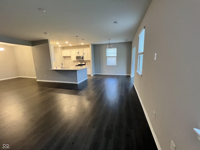 6729 Birmingham Ave, Mccordsville, IN 46055 - unfurnished living room with dark wood-style flooring and recessed lighting