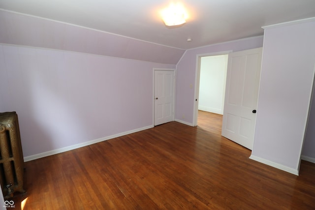 611 E Wabash Ave, Crawfordsville, IN 47933 - unfurnished bedroom with lofted ceiling and wood finished floors