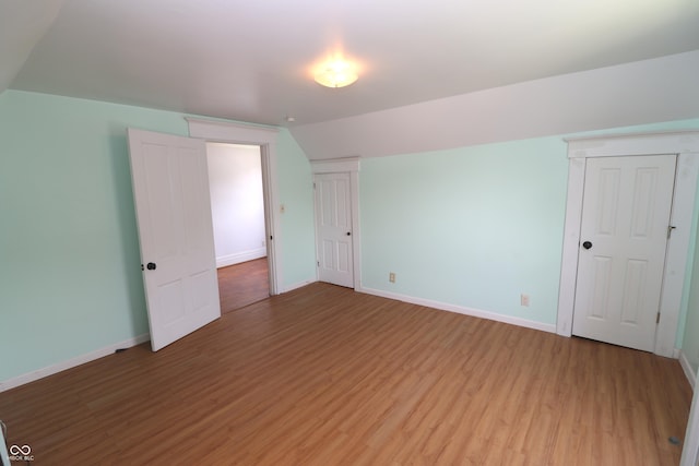 611 E Wabash Ave, Crawfordsville, IN 47933 - additional living space with light wood-type flooring and lofted ceiling