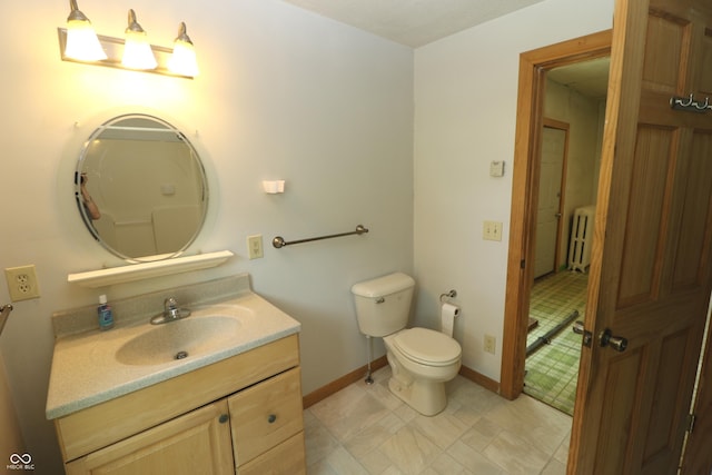 611 E Wabash Ave, Crawfordsville, IN 47933 - bathroom featuring vanity and radiator