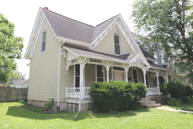 611 E Wabash Ave, Crawfordsville, IN 47933 - victorian home featuring a porch and roof with shingles