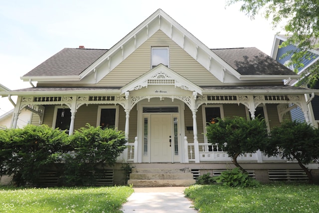 611 E Wabash Ave, Crawfordsville, IN 47933 - victorian house featuring a porch and a shingled roof