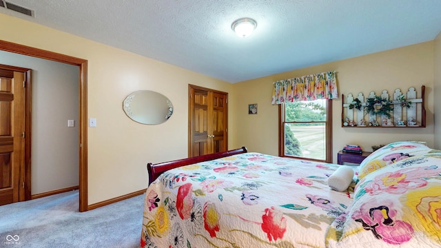 8818 Mathews Rd, Indianapolis, IN 46259 - bedroom with carpet flooring and a textured ceiling