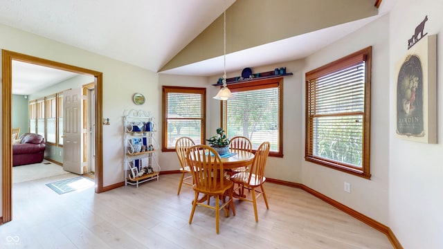 8818 Mathews Rd, Indianapolis, IN 46259 - dining room featuring light wood-style floors and vaulted ceiling