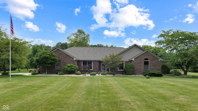 8818 Mathews Rd, Indianapolis, IN 46259 - ranch-style house with brick siding and a front lawn