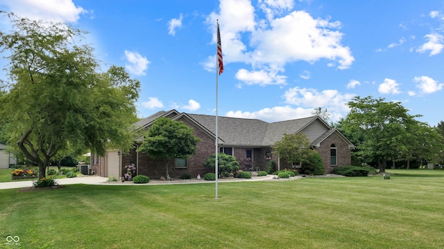 8818 Mathews Rd, Indianapolis, IN 46259 - view of front of house featuring brick siding, a front lawn, and an attached garage