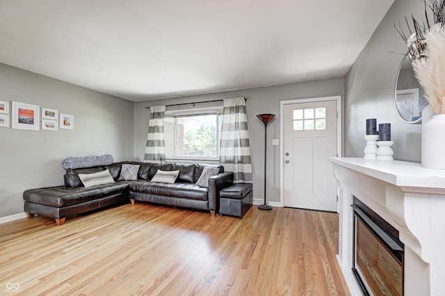 6143 Schoolwood Dr, Indianapolis, IN 46224 - living area featuring light wood-style floors and a fireplace