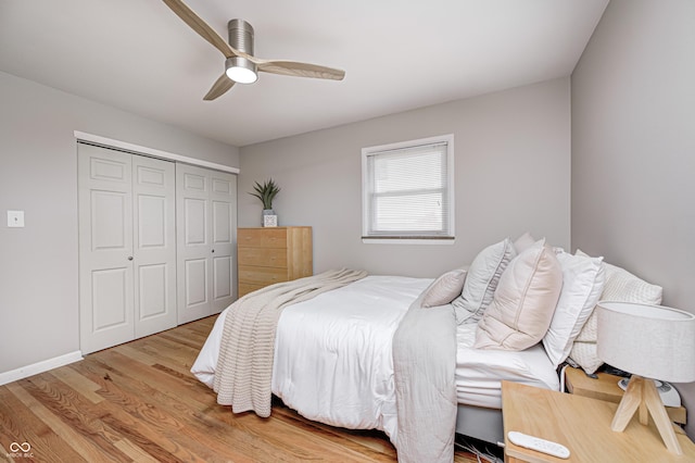 6143 Schoolwood Dr, Indianapolis, IN 46224 - bedroom with light wood-style flooring, a closet, and a ceiling fan