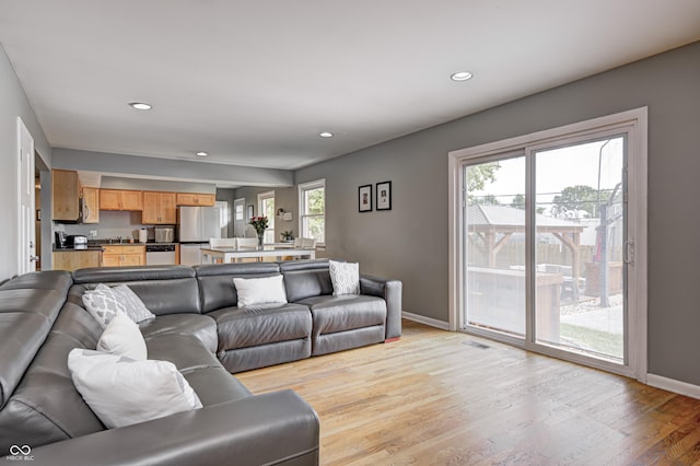 6143 Schoolwood Dr, Indianapolis, IN 46224 - living room with light wood-style floors and recessed lighting