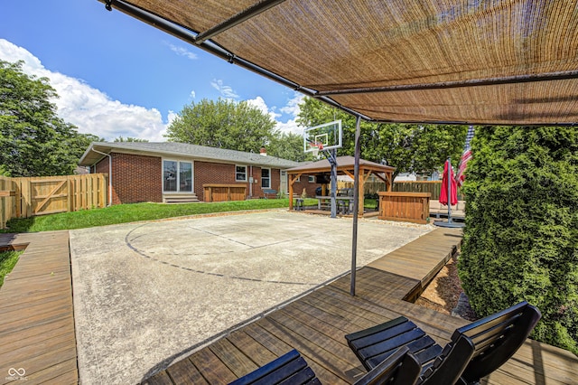 6143 Schoolwood Dr, Indianapolis, IN 46224 - view of patio featuring a gazebo, a hot tub, and a wooden deck