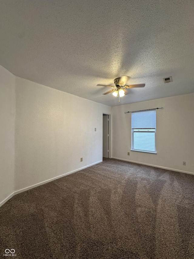 12639 Justice Xing, Fishers, IN 46037 - spare room with a ceiling fan, carpet floors, and a textured ceiling