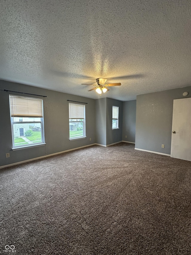 12639 Justice Xing, Fishers, IN 46037 - unfurnished room featuring a ceiling fan, carpet floors, and a textured ceiling