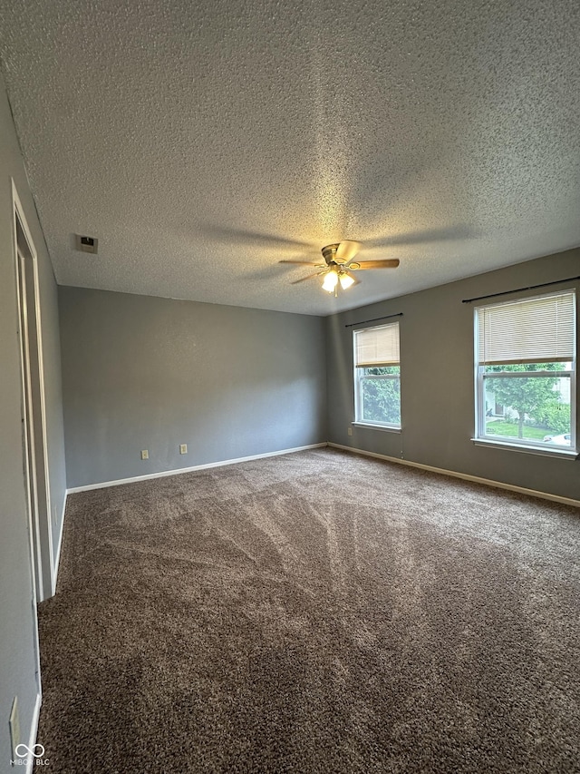 12639 Justice Xing, Fishers, IN 46037 - unfurnished room featuring carpet floors, a ceiling fan, and a textured ceiling