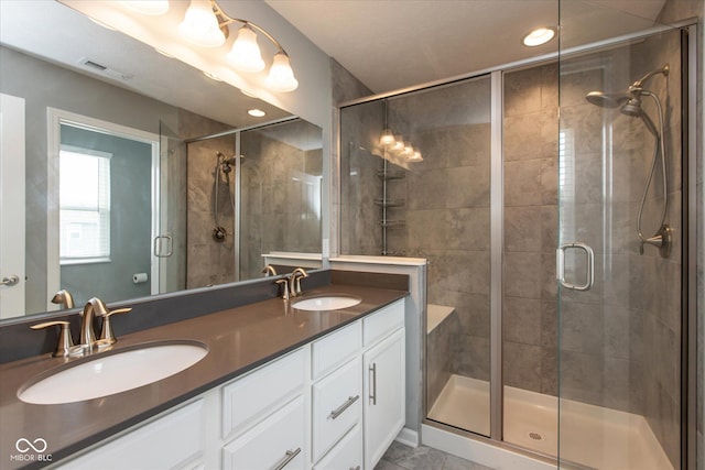 10334 Deercrest Ln, Indianapolis, IN 46239 - bathroom with a shower stall, double vanity, and recessed lighting