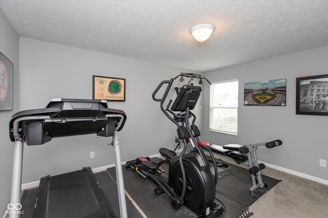 10334 Deercrest Ln, Indianapolis, IN 46239 - workout area featuring a textured ceiling and baseboards