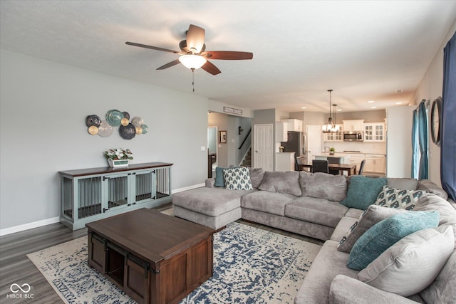 10334 Deercrest Ln, Indianapolis, IN 46239 - living room featuring a chandelier, stairway, dark wood-type flooring, ceiling fan, and recessed lighting