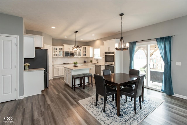 10334 Deercrest Ln, Indianapolis, IN 46239 - dining room with plenty of natural light, a chandelier, dark wood-style flooring, and recessed lighting