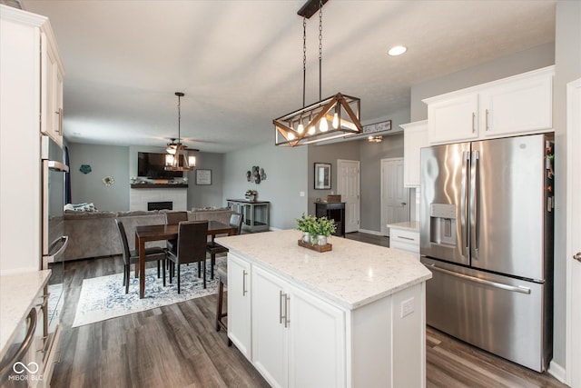 10334 Deercrest Ln, Indianapolis, IN 46239 - kitchen featuring stainless steel appliances, white cabinets, dark wood-type flooring, a center island, and recessed lighting