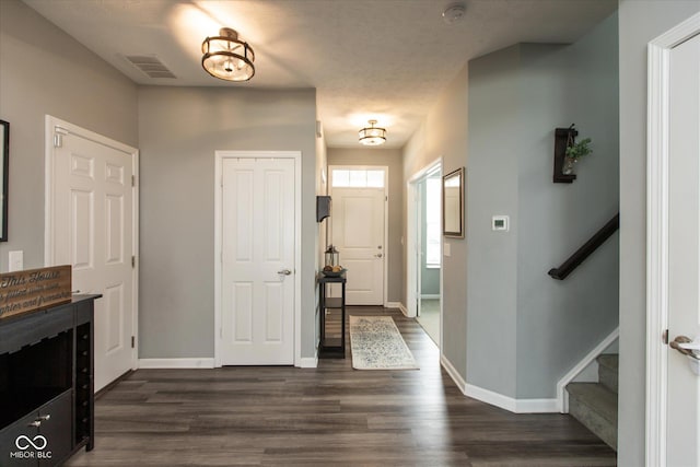 10334 Deercrest Ln, Indianapolis, IN 46239 - entrance foyer featuring dark wood-style floors and stairway