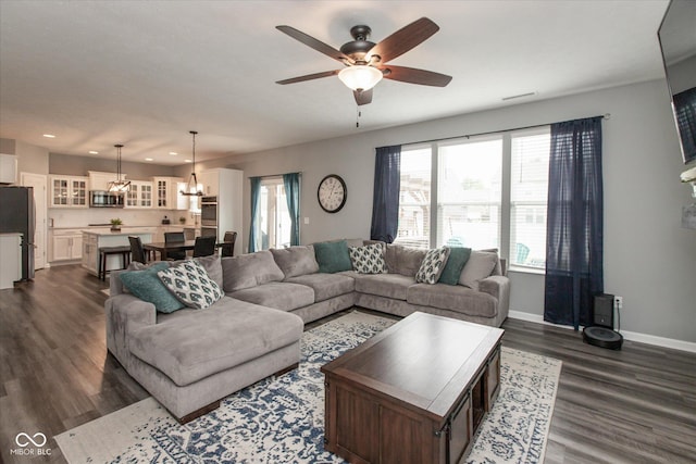 10334 Deercrest Ln, Indianapolis, IN 46239 - living room with dark wood-style flooring, a ceiling fan, recessed lighting, and a chandelier