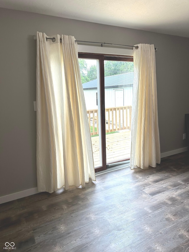712 W Main St, Thorntown, IN 46071 - spare room with dark wood-style flooring