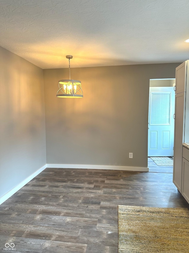 712 W Main St, Thorntown, IN 46071 - empty room featuring dark wood finished floors and a textured ceiling