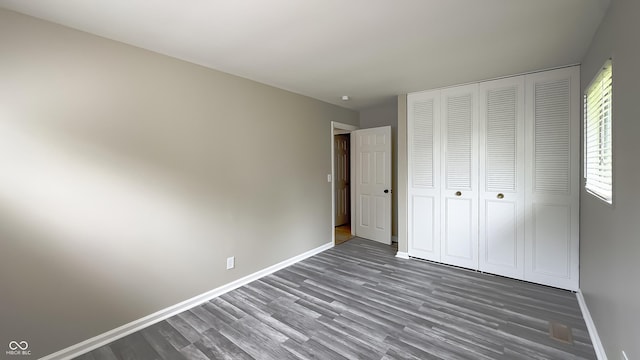 3019 E Berwyn St, Indianapolis, IN 46203 - unfurnished bedroom with wood finished floors and a closet