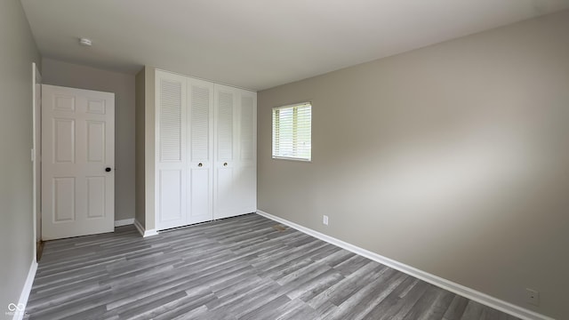 3019 E Berwyn St, Indianapolis, IN 46203 - unfurnished bedroom with wood finished floors and a closet