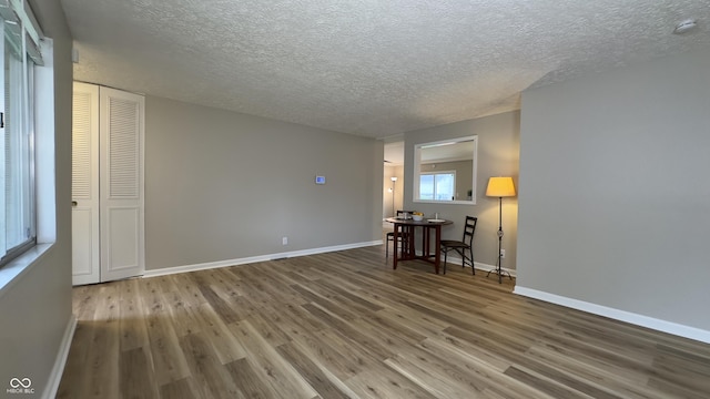 3019 E Berwyn St, Indianapolis, IN 46203 - unfurnished room with wood finished floors, a textured ceiling, and a smoke detector