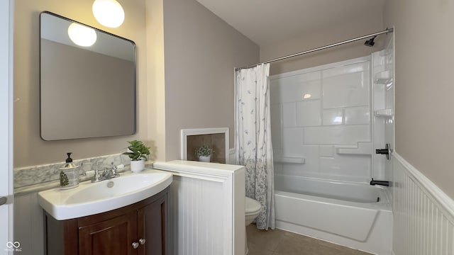 3019 E Berwyn St, Indianapolis, IN 46203 - full bathroom with vanity, tile patterned flooring, shower / bath combo, and a wainscoted wall