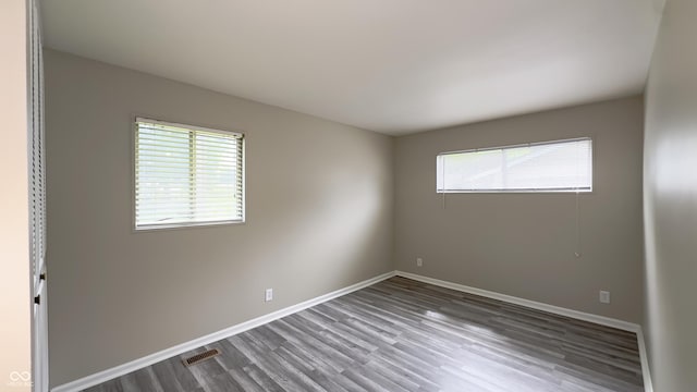 3019 E Berwyn St, Indianapolis, IN 46203 - spare room featuring wood finished floors and baseboards