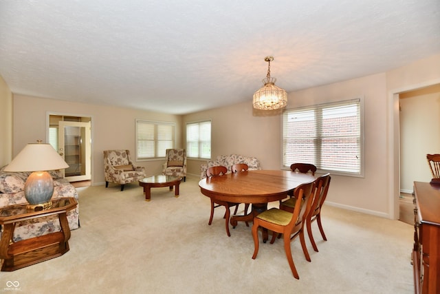 6965 Steinmeier Dr W, Indianapolis, IN 46220 - dining area featuring light colored carpet and a chandelier