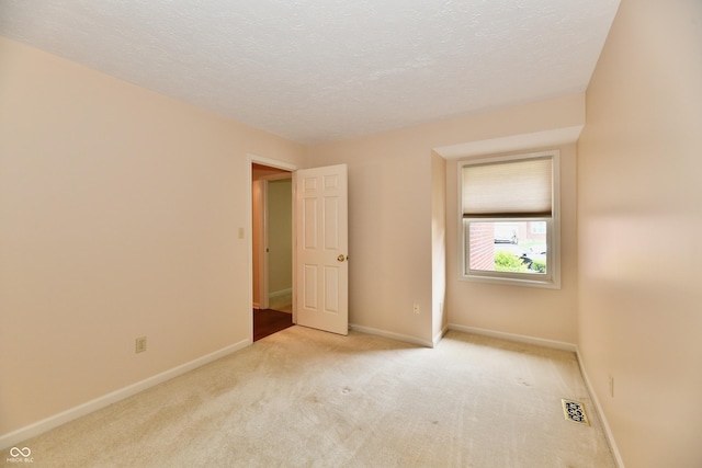 6965 Steinmeier Dr W, Indianapolis, IN 46220 - unfurnished bedroom with light carpet and a textured ceiling
