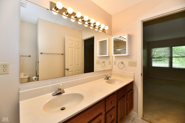 6965 Steinmeier Dr W, Indianapolis, IN 46220 - full bathroom with double vanity and tile patterned floors