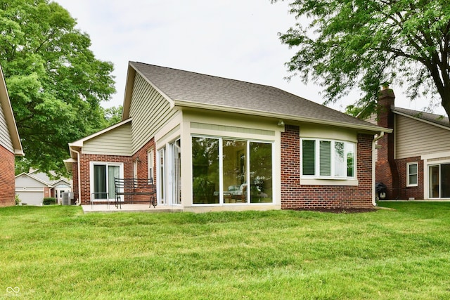 6965 Steinmeier Dr W, Indianapolis, IN 46220 - rear view of property with brick siding and a yard