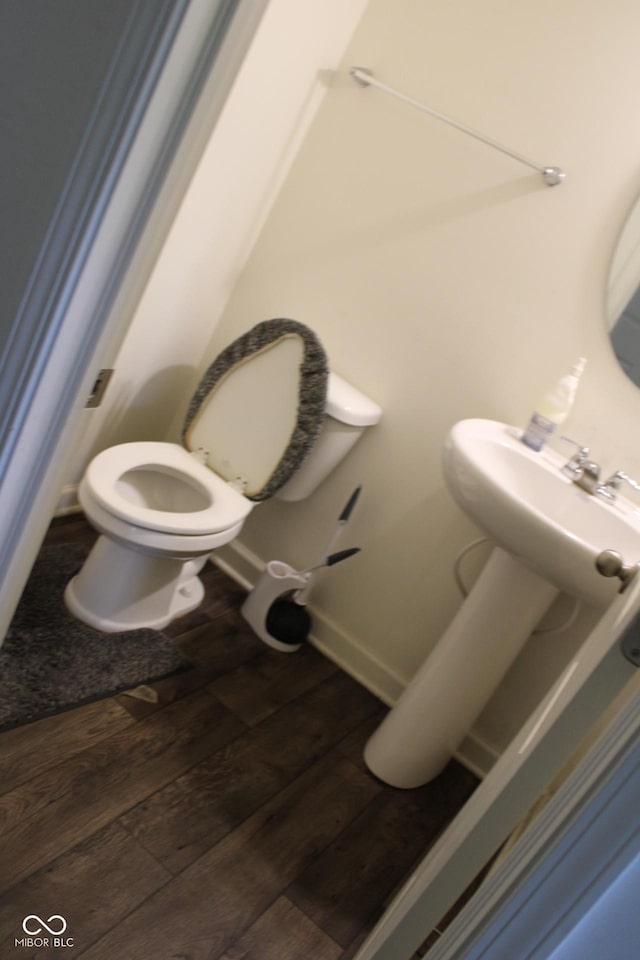 9068 Thames Dr, Avon, IN 46123 - bathroom with toilet and wood-type flooring