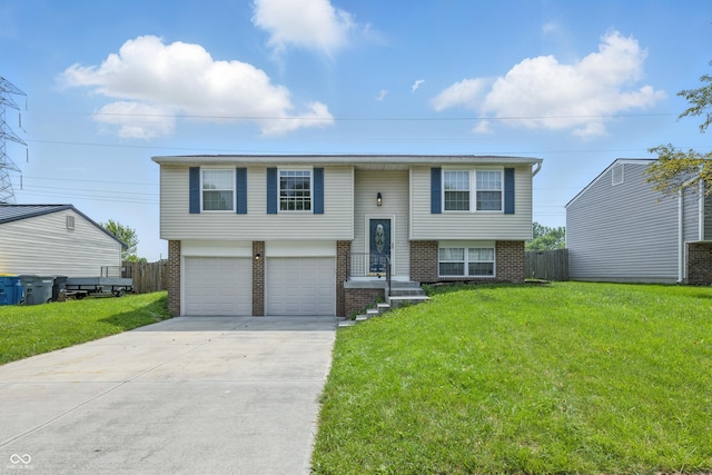 5503 Antoneli Ln, Indianapolis, IN 46237 - bi-level home with brick siding, concrete driveway, and a garage