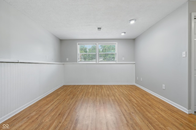5503 Antoneli Ln, Indianapolis, IN 46237 - empty room with light wood finished floors and a textured ceiling